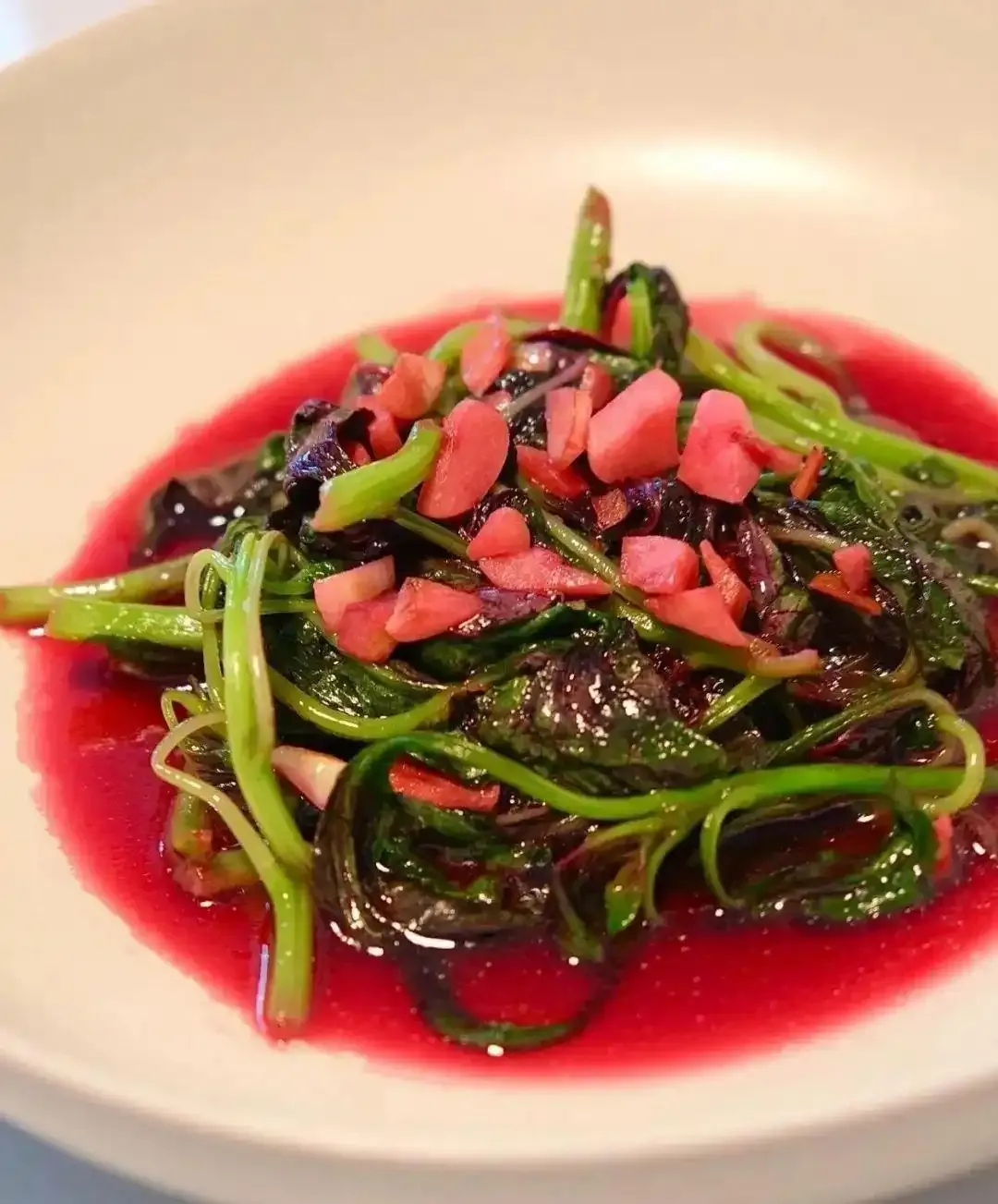 Stir-fried amaranth greens — a seasonal summer vegetable served around the summer solstice
